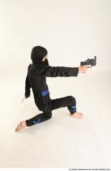 VLASTIMIL KNEELING POSE WITH GUN